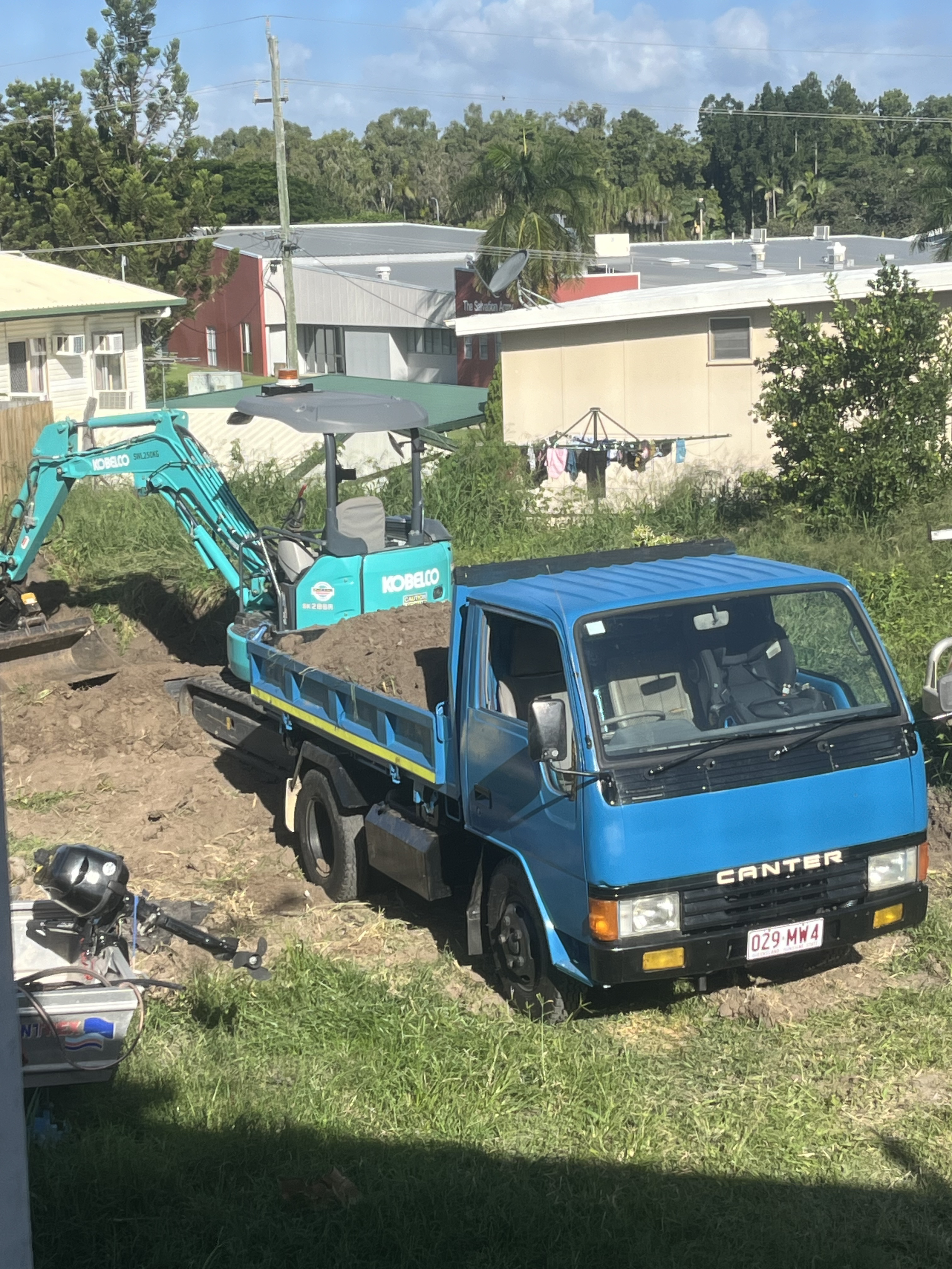 MSB Civil Mitsubishi tipper truck and Kobelco excavator on a Rockhampton residential site
