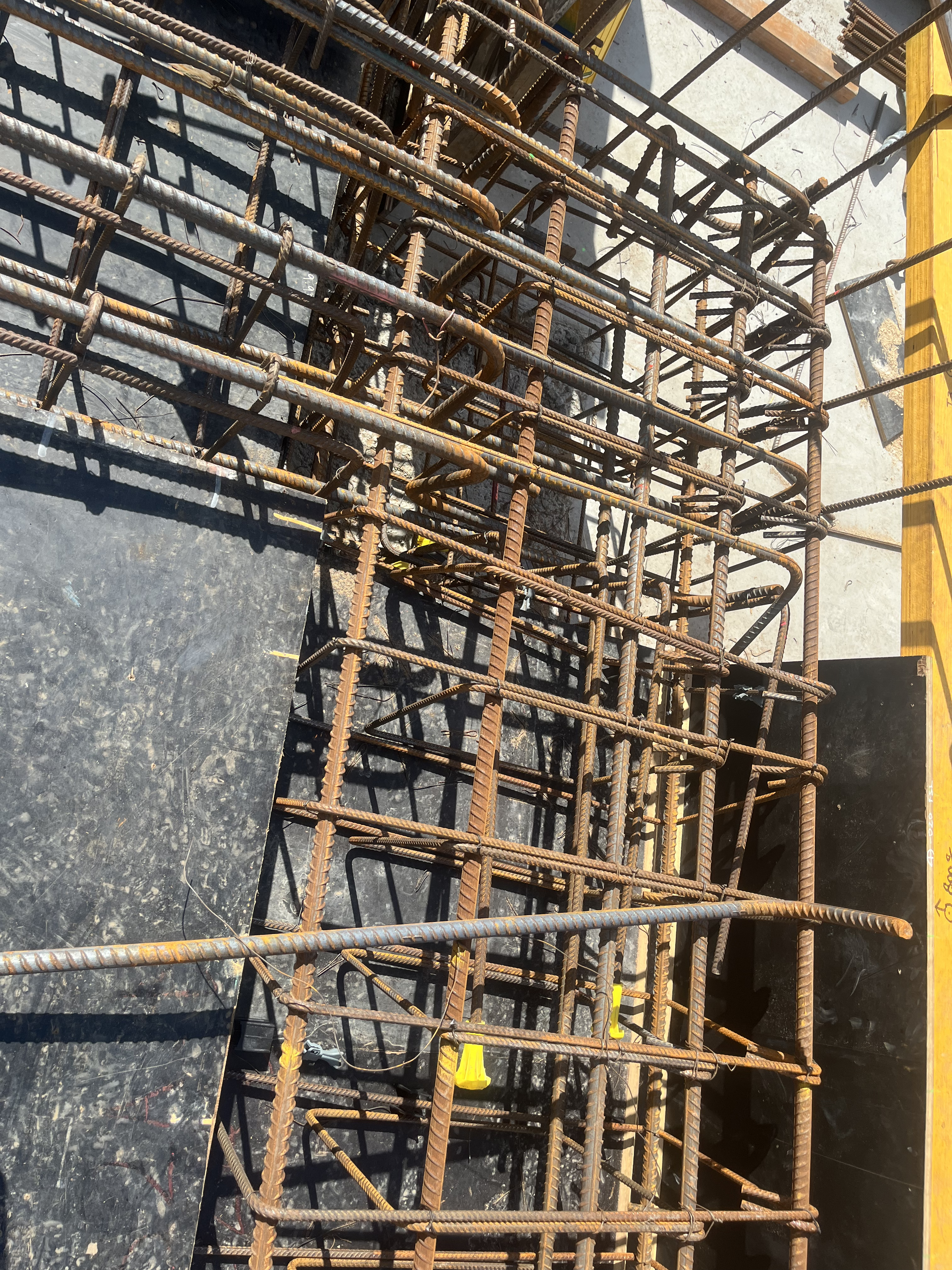 Dense column reinforcement cage viewed from above — pre-pour detail shot